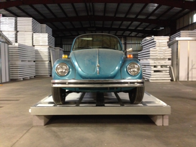 Volkswagen weighing 2,844 lbs. atop a standard 24-guage panel caused a mere 1/8” deflection.